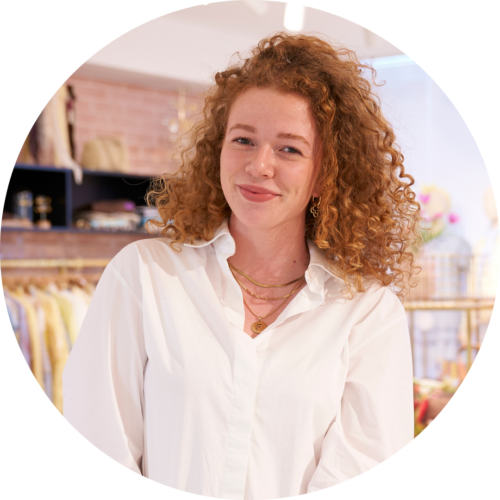 Famke van Rennes, Recruiter Retail, Smiling at the camera in the showroom.