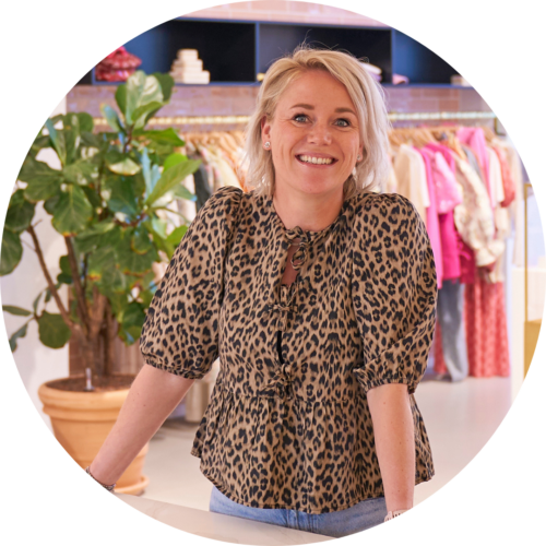 Nikki van der Pol, Recruitment Coordinator, smiling portrait photo in the showroom.