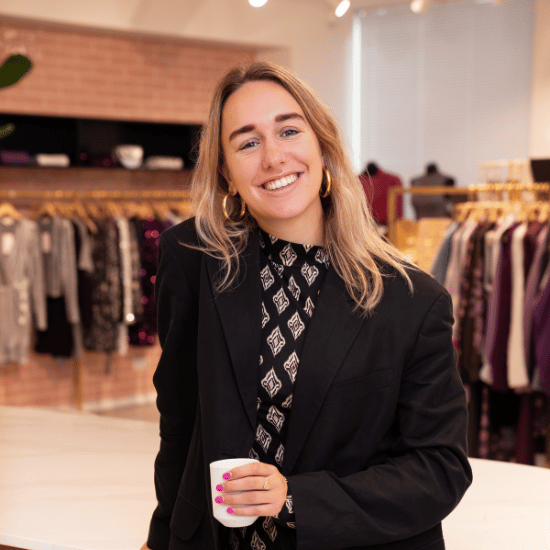 Eline Bielschowsky, Buyer, smiling portrait photo in the showroom.
